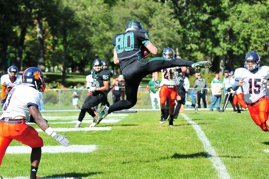 Luke Domask leaps to make a great touchdown catch for Glenbard West. | Patrick Gleason ~ For Sun-Times Media 