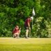 Minneapolis Roosevelt Golfers on the green lining up their putts