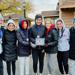Westonka girls cross country runners holding their first-place award