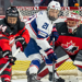 Team USA falls 3-0 to Canada in game 6 of the Rivalry Series. The photograph shows Hilary Knight in front of the net. 