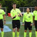 Referees flip coin ahead of kick off