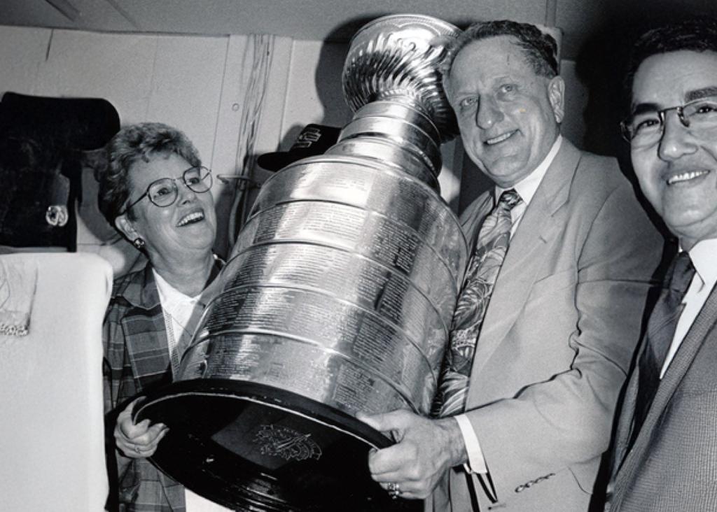 Minneapolis Roosevelt High School Hockey Coach Bob Johnson holding up the Stanley Cup trophy as Head Coach of the Pittsburgh Penguins
