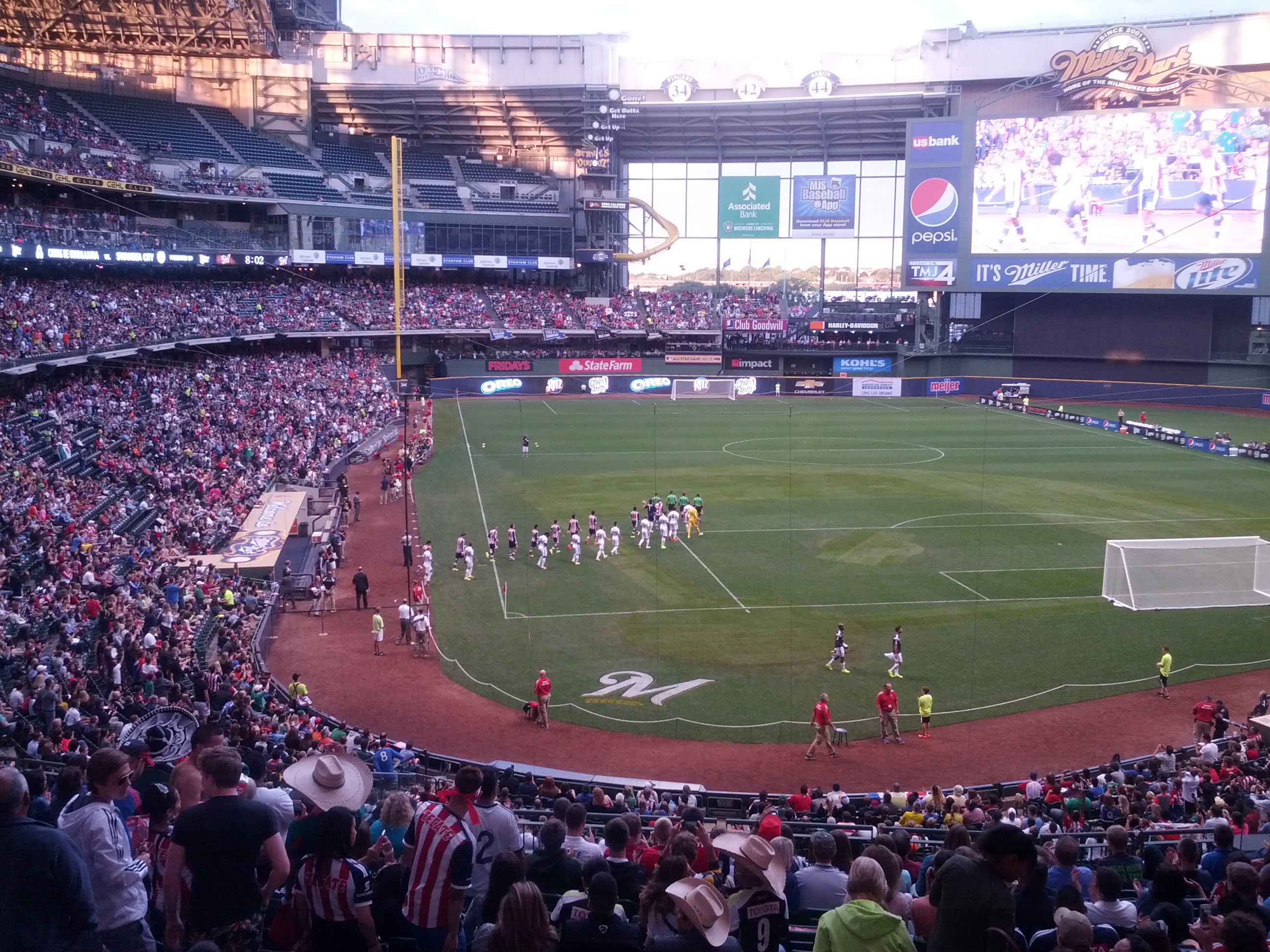 Chivas and Swansea City players take the field for the first soccer game at Miller Park in front of a crowd of 31,237.