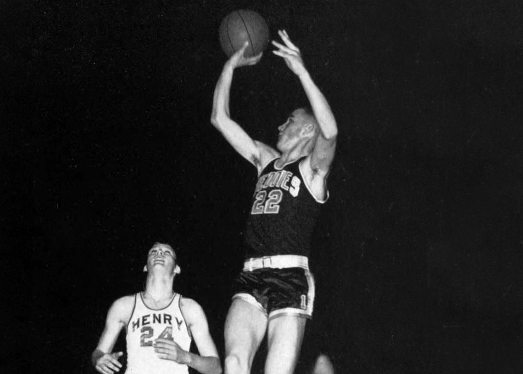 Minneapolis Roosevelt alumn Tom Nordland shooting a jumpshot over a Minneapolis Patrick Henry player in 1957