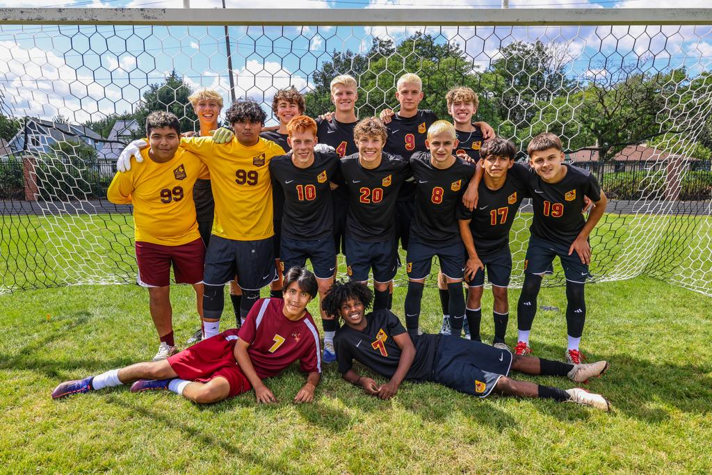 Image of Minneapolis Roosevelt High School’s boys varsity soccer team Seniors of 2025 grouped together for a photo on the field at Al Gowans Stadium