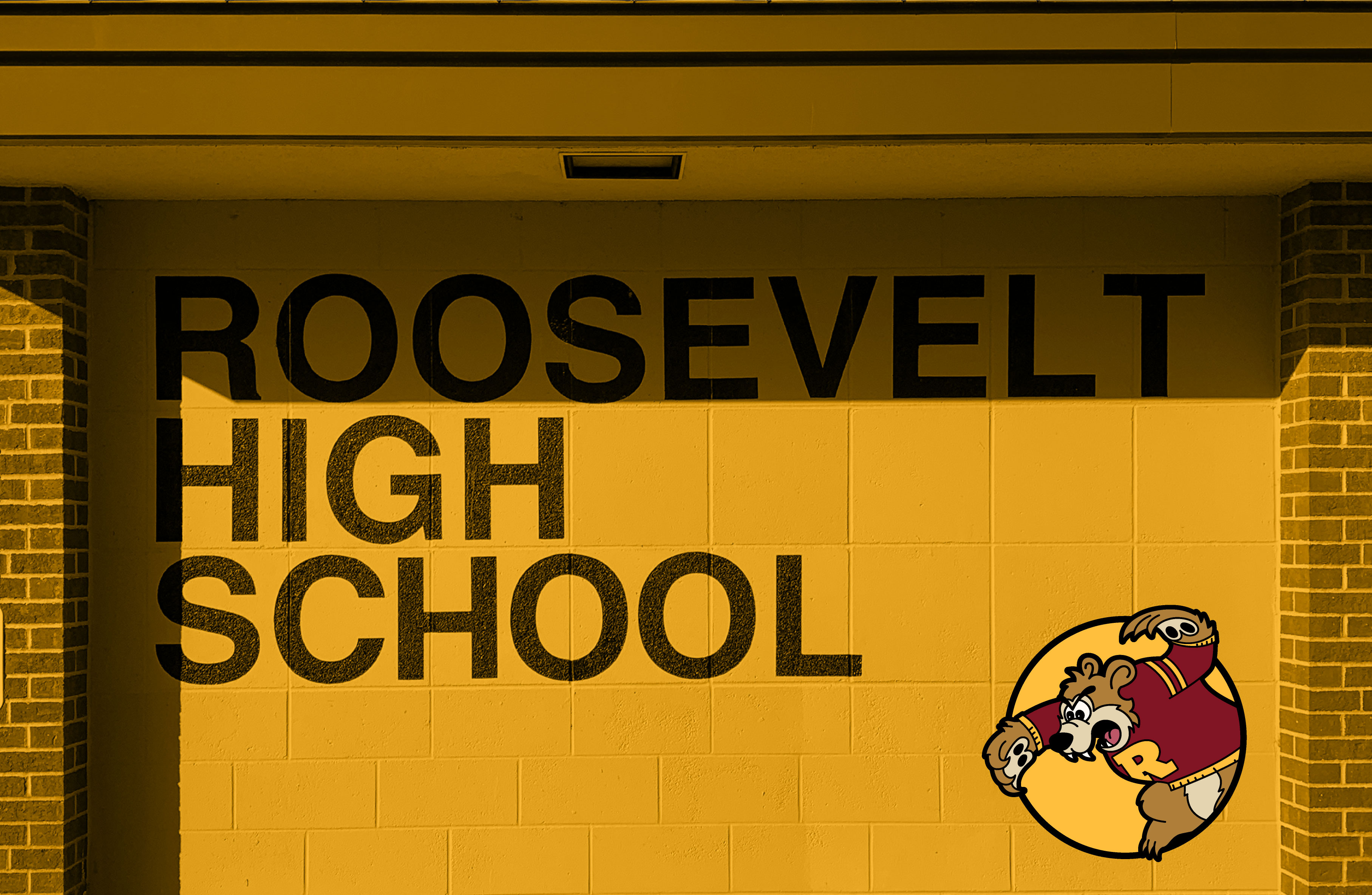 Image of an exterior wall at Al Gowans Stadium at Minneapolis Roosevelt High School. Painted on a smooth cylinder block wall are black stacked words ROOSEVELT HIGH SCHOOL. The photo is a gold tinted color.