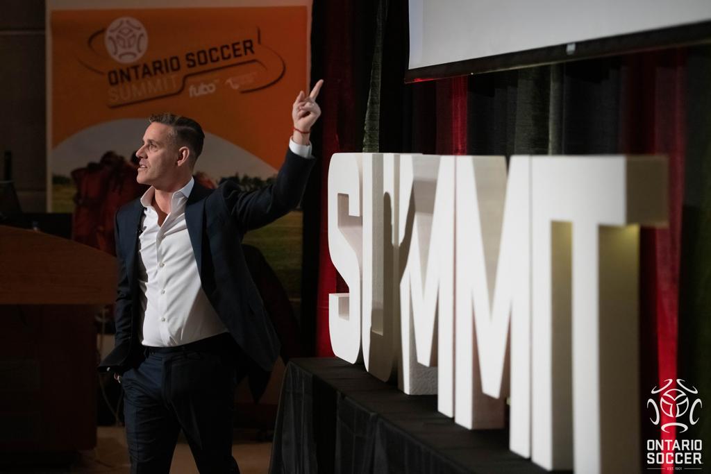 John Herdman giving his keynote speech on Day 2 of the Summit in Marion Hall