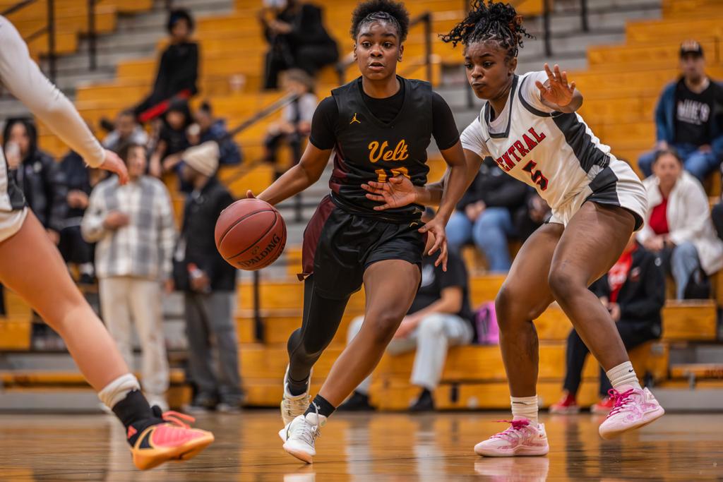 Minneapolis Roosevelt Girls Basketball player drives up the court during a game vs St Paul Central